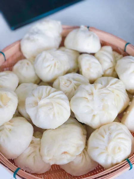 fresh raw dumplings on a white plate