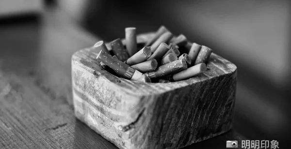 close up of a wooden matches with a knife