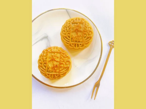 chinese new year festival moon cake with yellow and white background