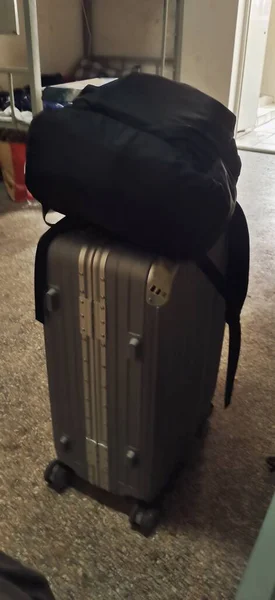 a suitcase with a luggage and a bag of a plane