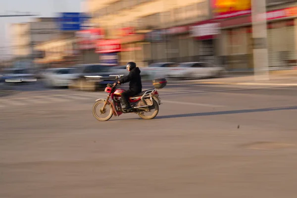 cyclist riding a bike in the city