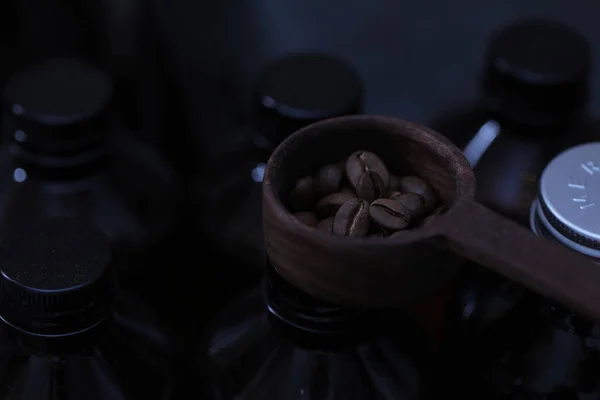 coffee beans and nuts on a black background