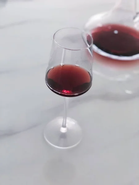 glass of red wine on white background