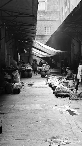 black and white image of a man in the city