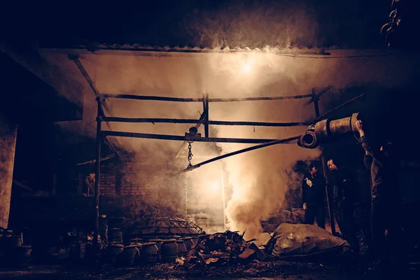 blacksmith with a fire in the oven