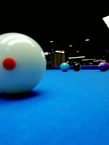 billiard ball on a pool table