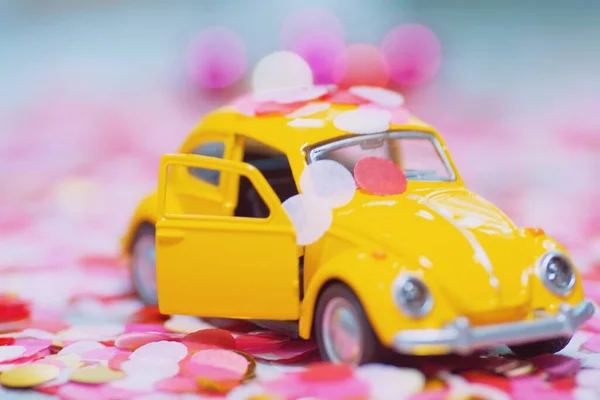 toy car with a pink background