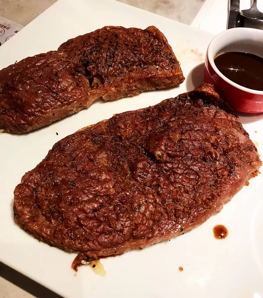grilled beef steak with sauce and spices