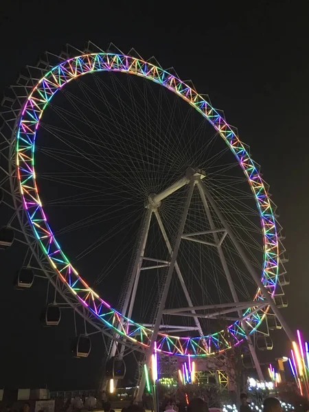 ferris wheel in amusement park, london, uk