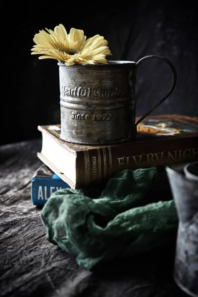 cup of tea and books on wooden table