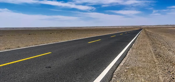 empty asphalt road in the desert