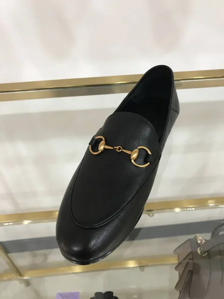 black leather shoes on the background of the store