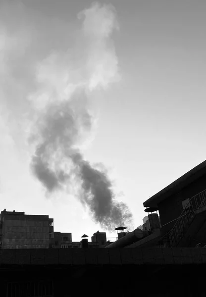 black and white smoke of the factory