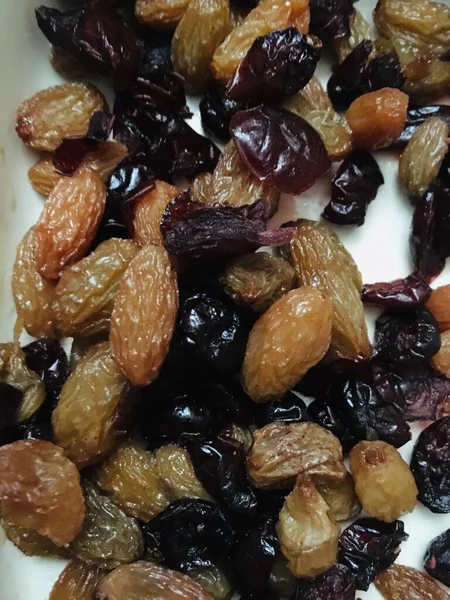 dried raisins on a white background