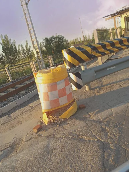 construction site with a road and a traffic cone