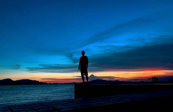 silhouette of a man on the beach