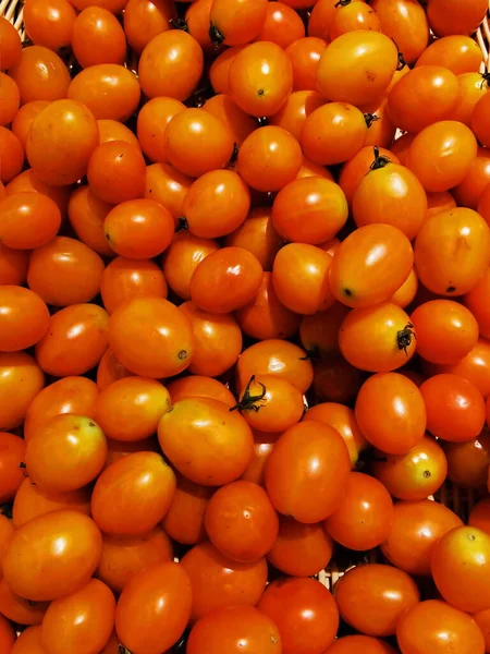 fresh ripe tomatoes on a market