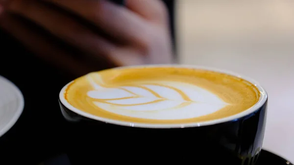 close up of a cup of coffee with a white background