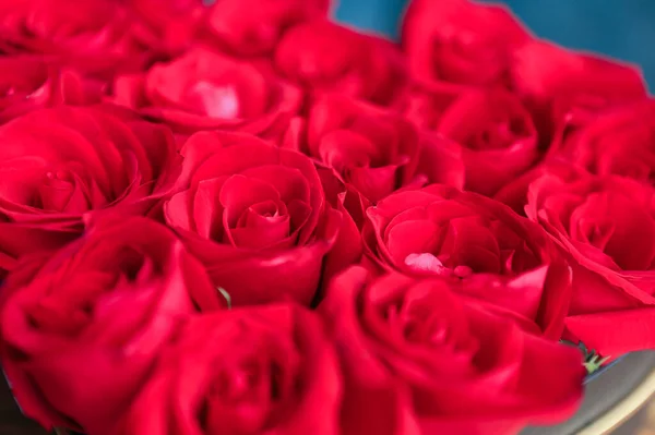 red roses on a background of a beautiful bouquet of pink and white rose