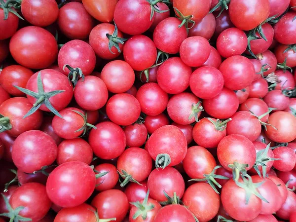 red tomatoes on a market stall
