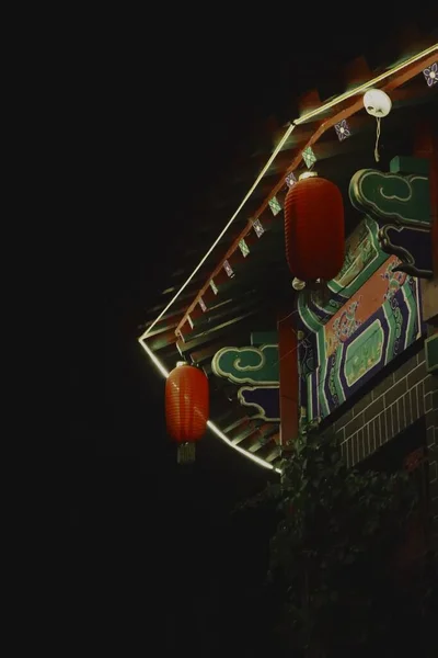 the red toy train on the roof of the building