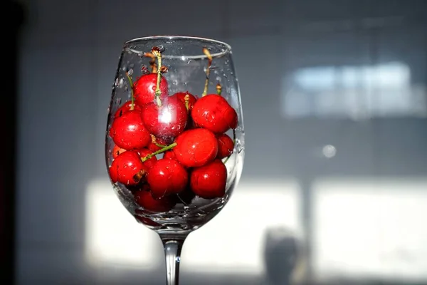 red and white wine in a glass jar on a black background
