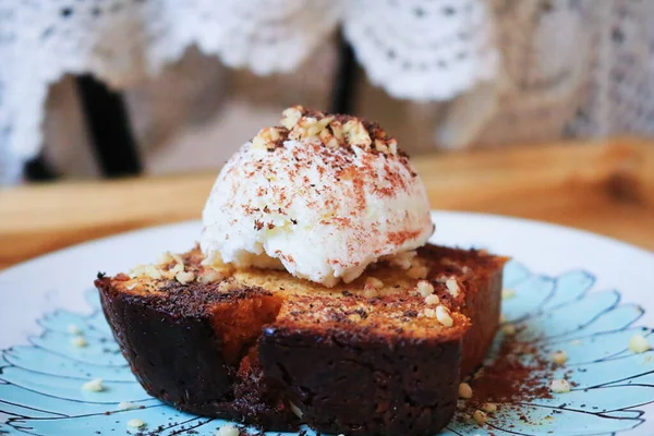 chocolate cake with icing and powdered sugar