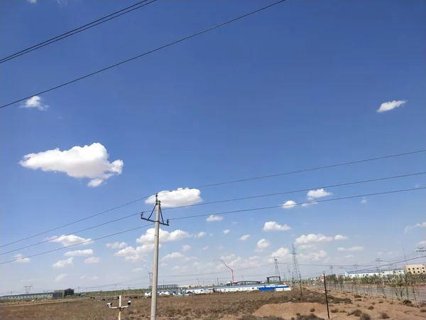 high voltage power line and blue sky