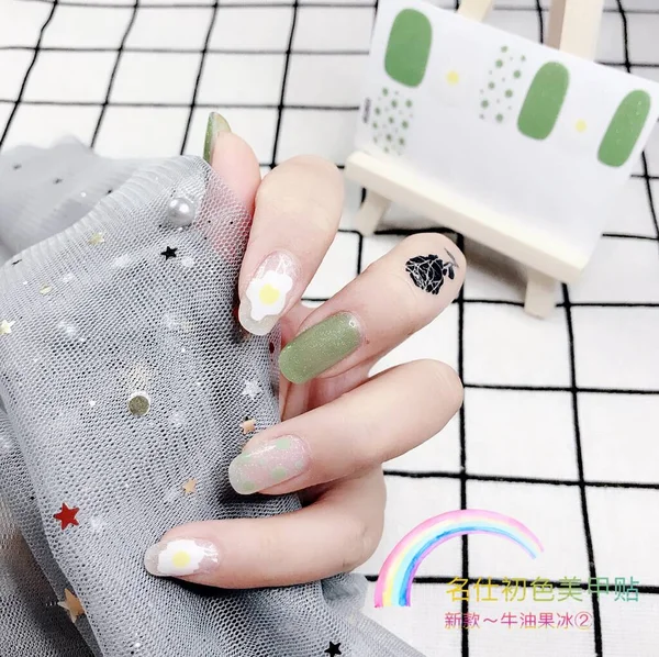 woman hand drawing a manicure on a white background
