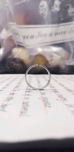 wedding rings and glasses on the table