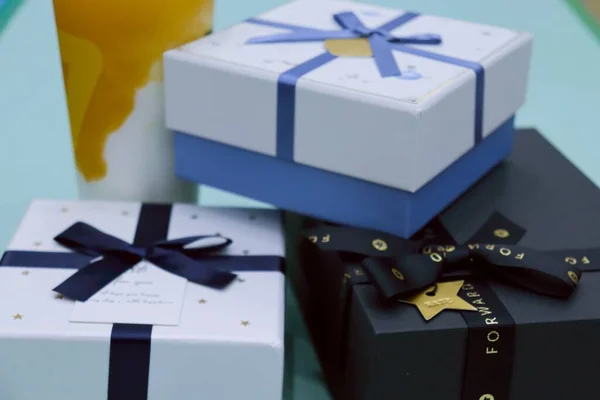 gift boxes with blue ribbon on a white background