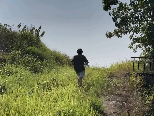 man walking in the field