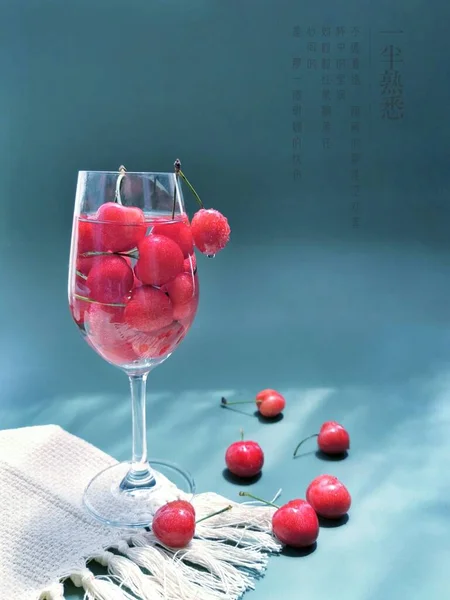 red wine in a glass jar on a blue background
