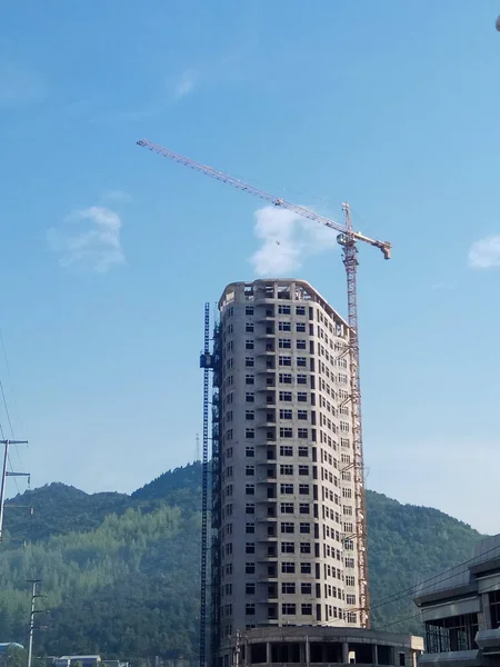 construction of a building against a background of blue sky