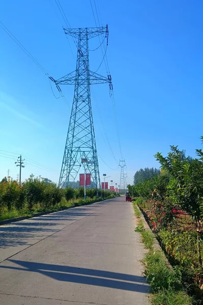 high voltage power line on the background of the blue sky