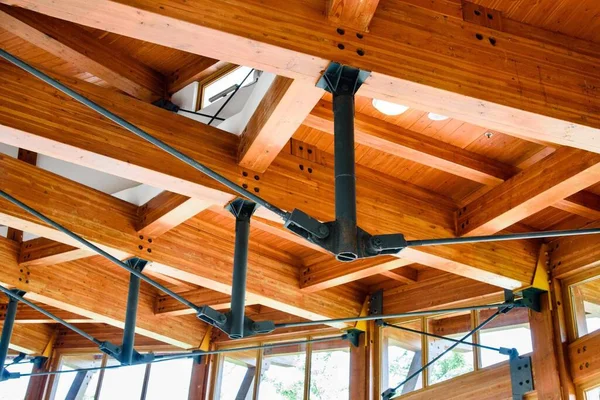 wooden beams of a house with a roof