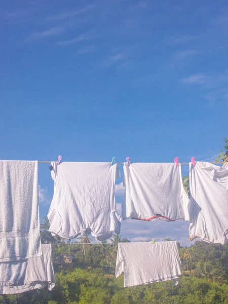 white laundry on the beach