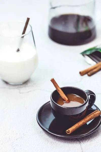 hot chocolate with cinnamon and spices on a white background. selective focus.