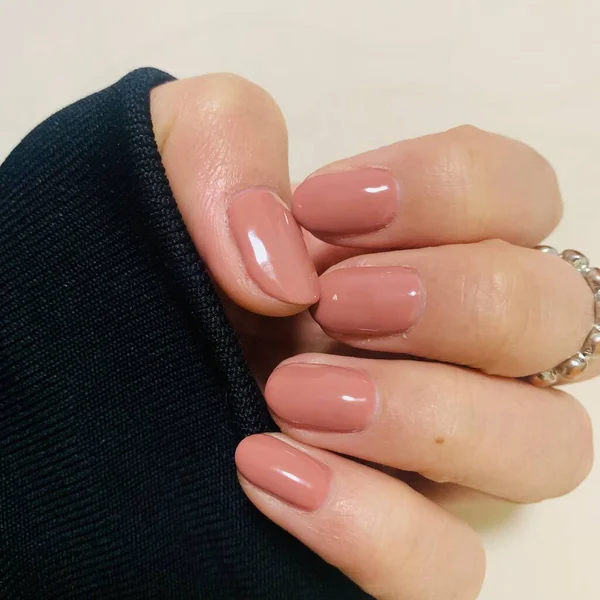 beautiful manicure with a red nail polish on a white background
