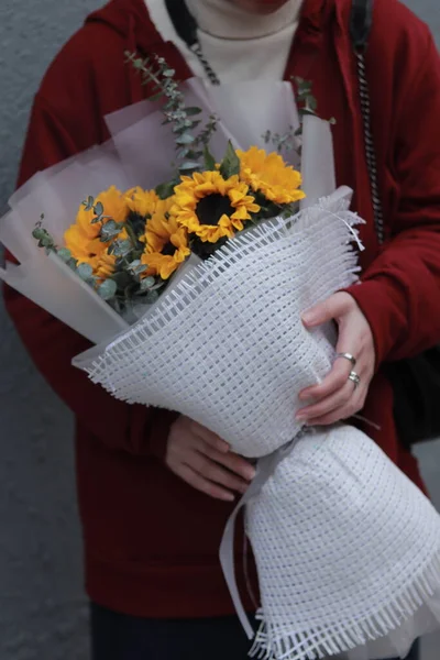 a man with a bouquet of flowers