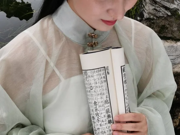 woman with bible and rosary