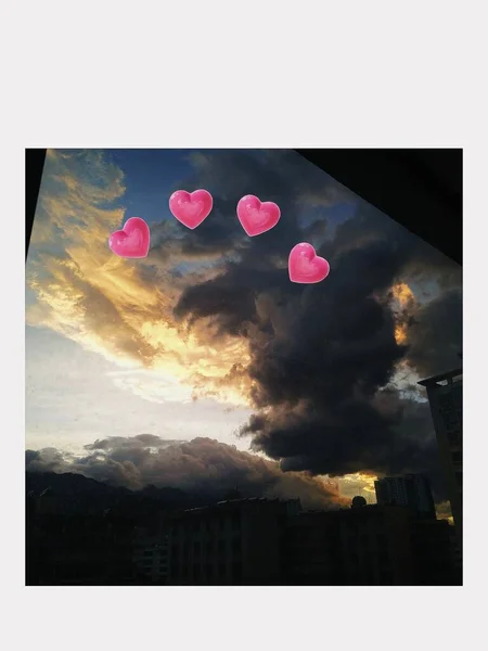beautiful landscape with a heart and a red cloud