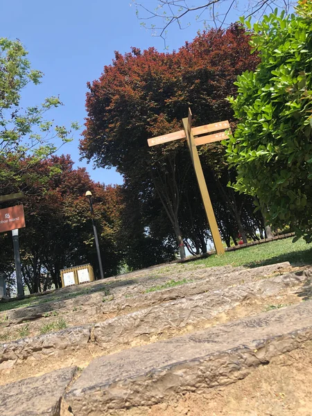 wooden cross on the background of the church
