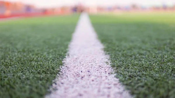 green grass and a football field