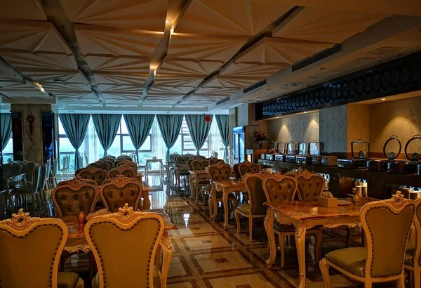 interior of a restaurant with chairs and tables