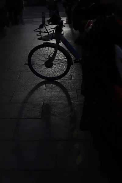 silhouette of a bicycle on the street