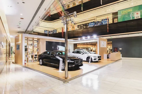 interior of a modern store with a lot of cars
