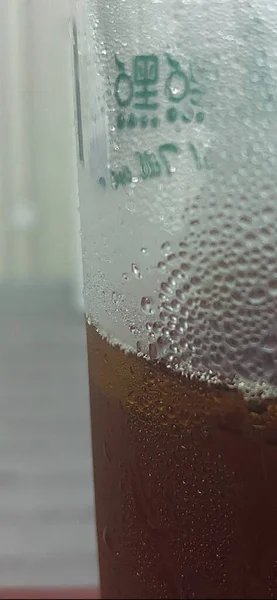 beer glass with water drops on the table