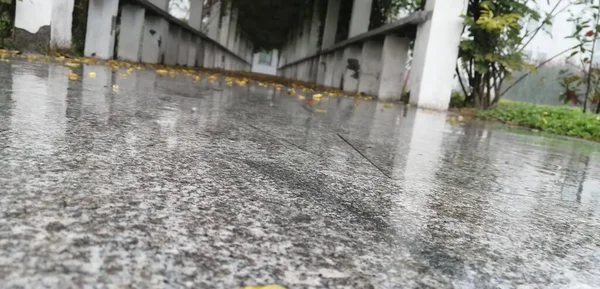 concrete floor with a lot of water drops