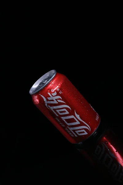 red and black gas can with a gun on a dark background